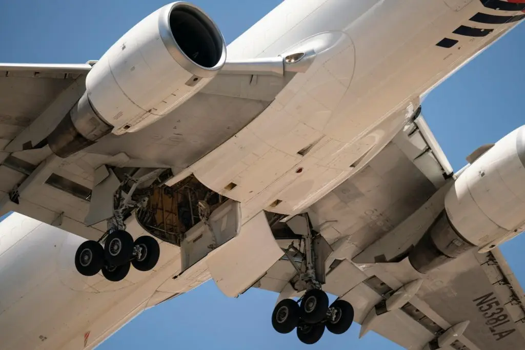 Detailed view of airplane undercarriage during takeoff at Santiago, Chile airport.